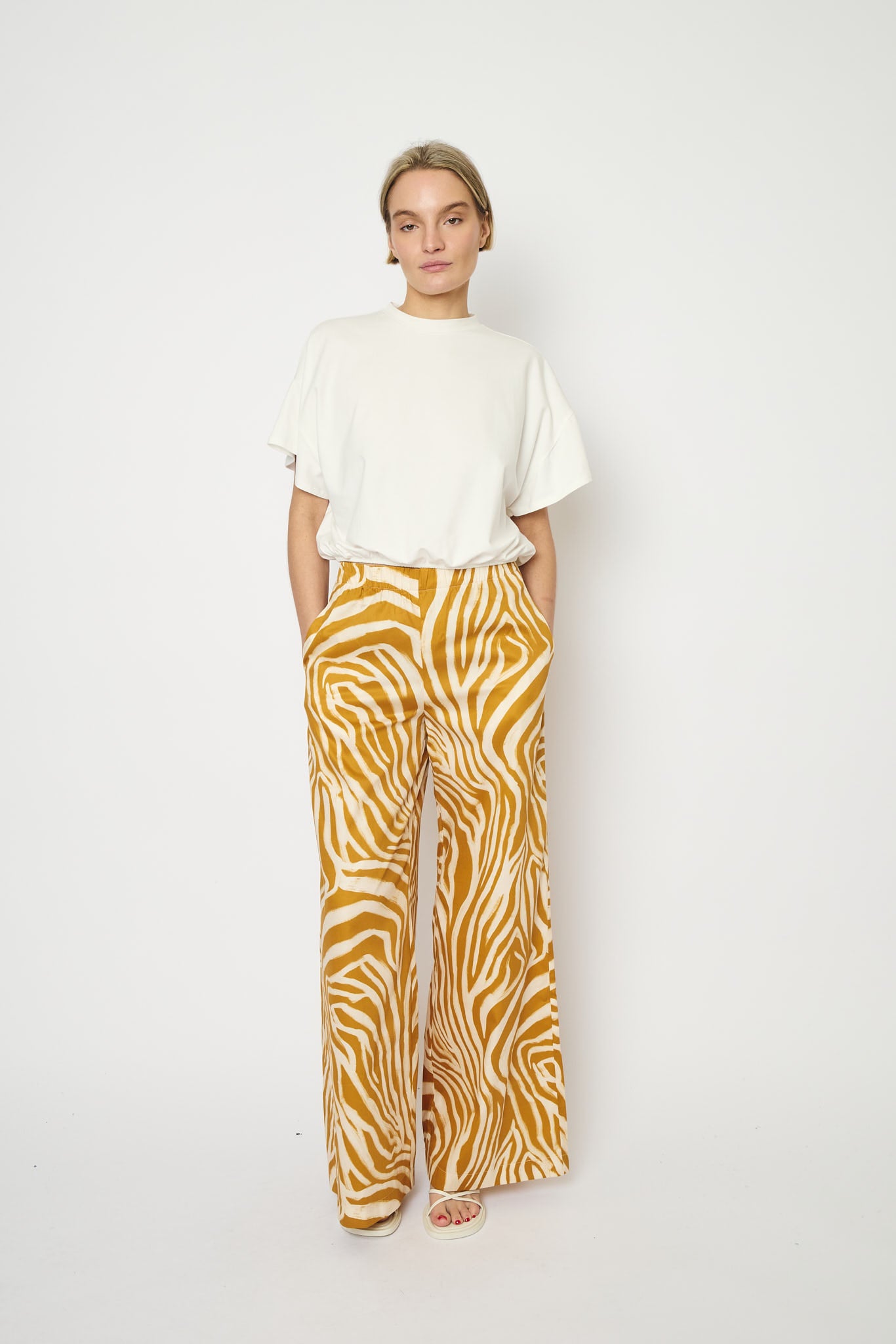 RE/BORN Antwerp Tina Zebra Print trousers Zebra Ochra